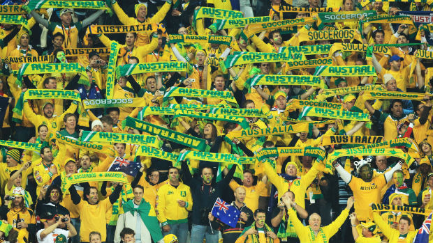 Socceroos fans show their green and gold support.