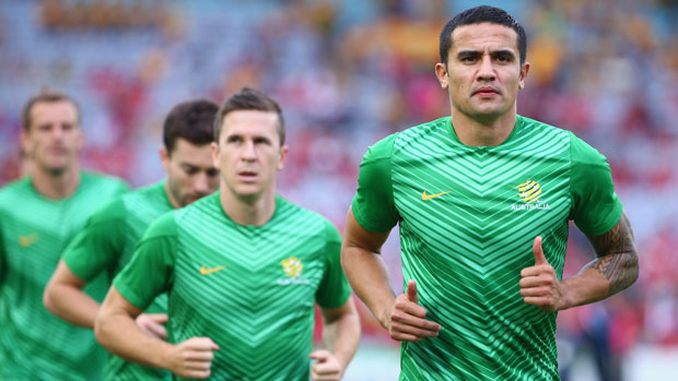 Tim Cahill warms up before  a Socceroos match.