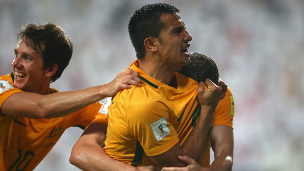 Tim Cahill celebrates with teammates after scoring against the UAE.
