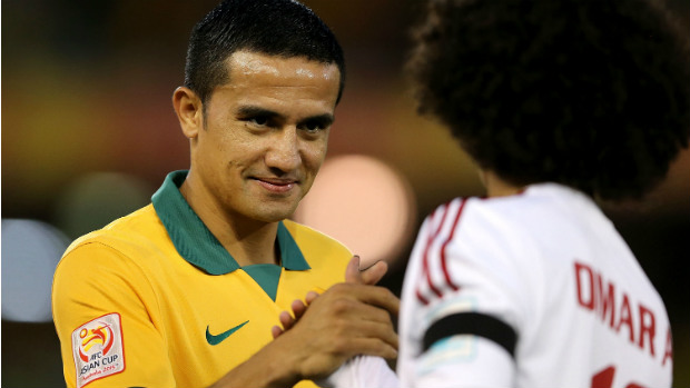 Tim Cahill shakes hands with opponent Omar Abdulrahman during Tuesday's semi-final.