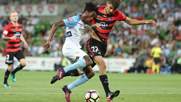 Wanderers defender Jonathan Aspropotamitis tackles City forward Bruce Kamau when their sides met in Round 14 of the Hyundai A-League.