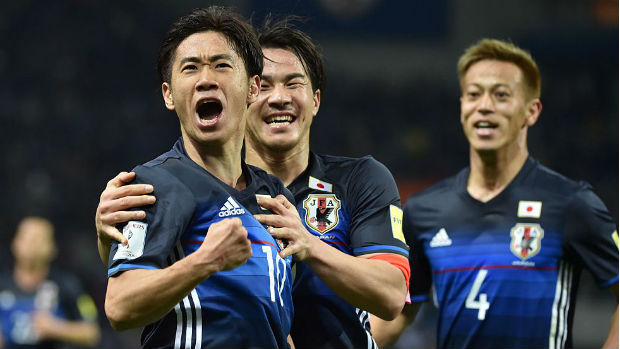 Japan's Shinji Kagawa, Shinji Okazaki and Keisuke Honda celebrate a goal in World Cup qualifying.