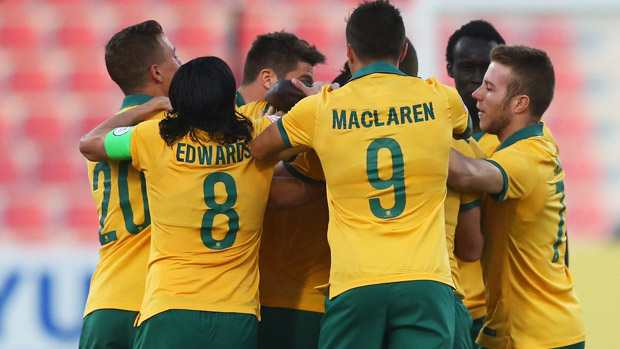 Olyroos players celebrate James Donachie's early goal against Vietnam.