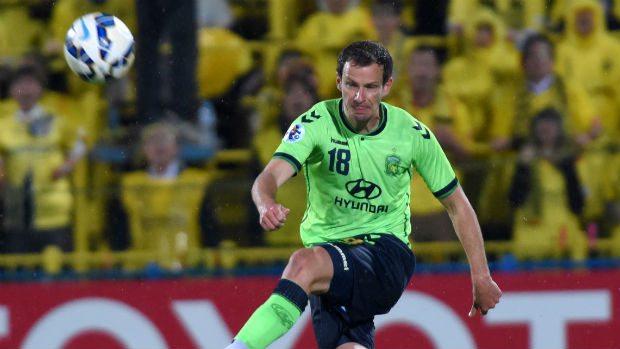 Alex Wilkinson makes a clearance for Jeonbuk Motors in the AFC Champions League.
