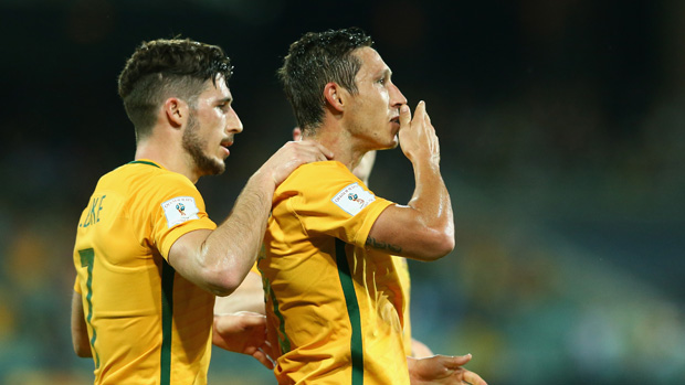 Mark Milligan celebrates a goal with teammate Mat Leckie.