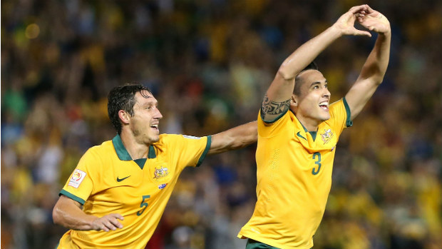 Jason Davidson and Mark Milligan celebrate the Socceroos second goal on Tuesday night.