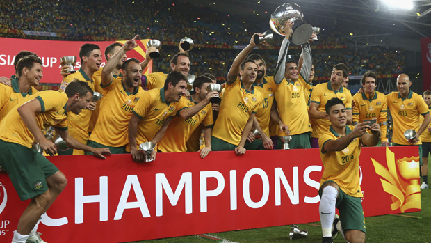 The Socceroos celebrate after winning the Asian Cup final.