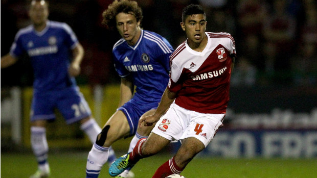 Massimo Luongo scoots away from Chelsea's David Luiz in last season's League Cup.