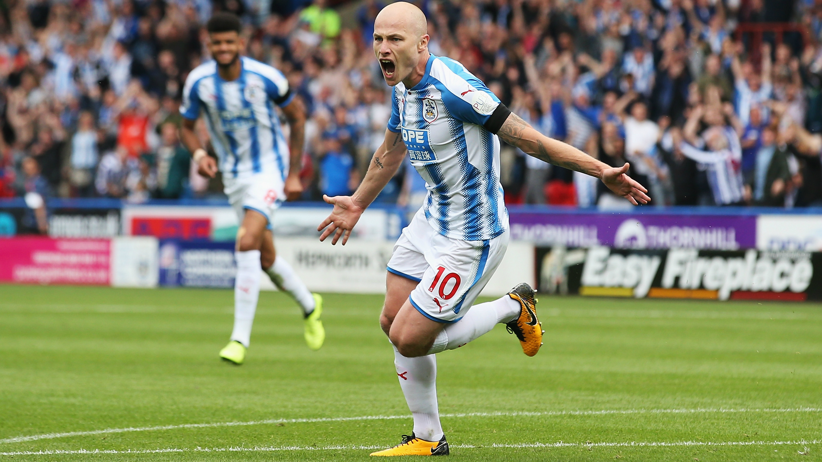 Aaron Mooy celebrates after scoring a superb winner for Huddersfield Town in the EPL against Newcastle United.