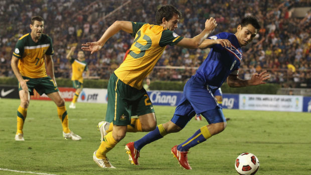 Robbie Kruse jostles for the ball when the Caltex Socceroos last played Thailand in Bangkok in 2011.