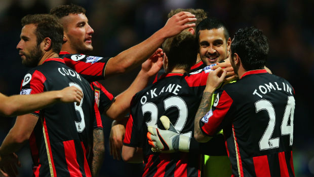 Bournemouth goalkeeper Adam Federici is congratulated by teammates after his shoot-out heroics.