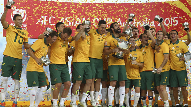 The Socceroos celebrate after winning the Asian Cup final.