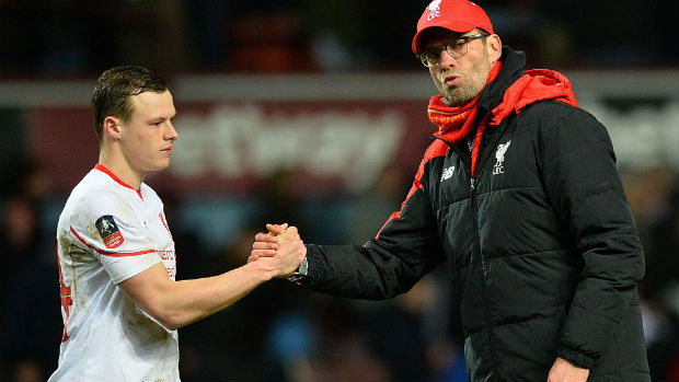 Liverpool defender Brad Smith shakes hands with manager Jurgen Klopp.