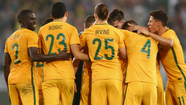 The Caltex Socceroos celebrate Mat Leckie's late winner against Greece at ANZ Stadium.