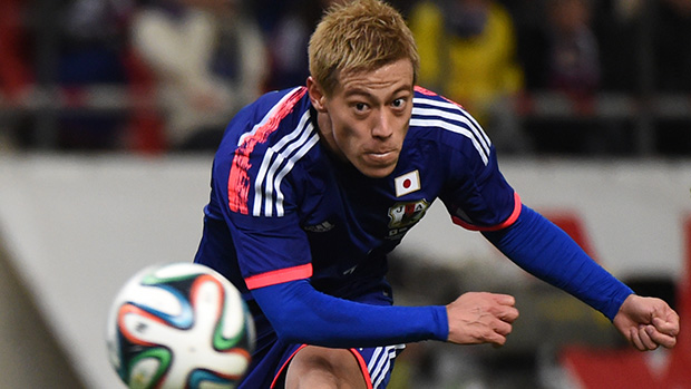Keisuke Honda connects with the ball during Japan's win over Honduras.