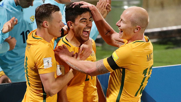 Massimo Luongo celebrates with Aaron Mooy and Brad Smith after opening the scoring against Iraq in WCQ.