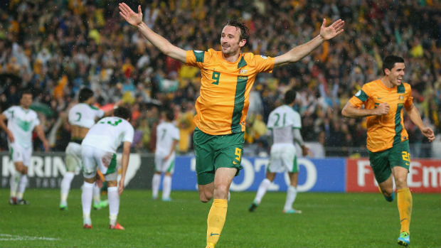 Former Socceroos striker Josh Kennedy celebrates scoring the goal that sealed Australia's place at the 2014 FIFA World Cup.