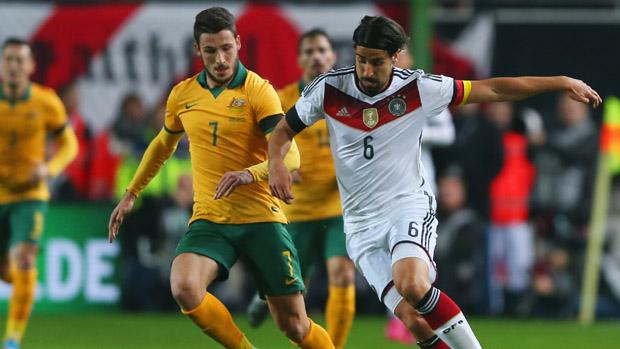 Socceroo winger Mat Leckie fights for the ball with German midfielder Sami Khedira.