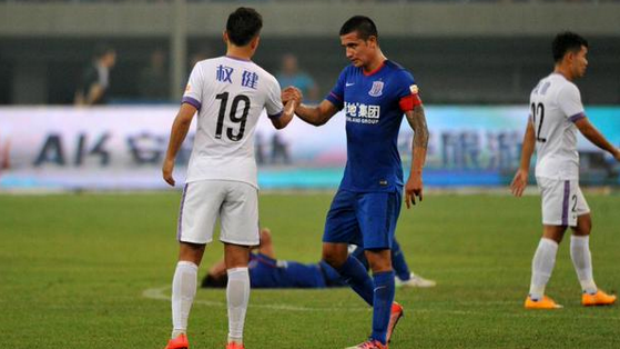 Tim Cahill shakes hands with the opposition at full-time in the Chinese Super League.