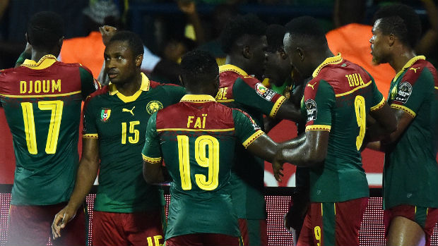 Cameroon players celebrate scoring against Ghana at the African Cup of Nations.