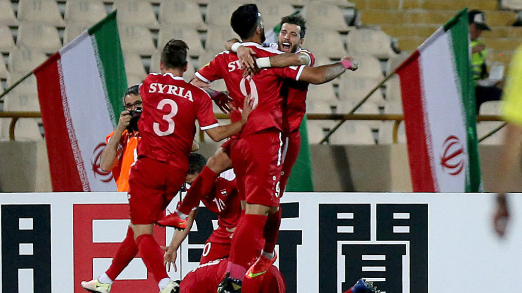 Syria booked third spot in Group A following a 2-2 draw with Iran.