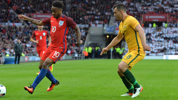 Bailey Wright fights for the ball with England winger Raheem Sterling at the Stadium of Light.