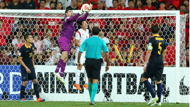 Socceroos goalkeeper Mat Ryan leaps high to make a save against Korea Republic.