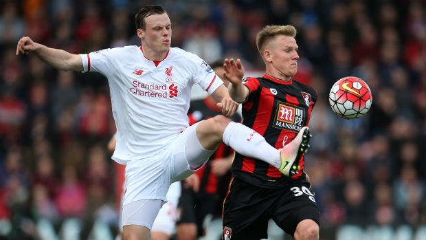 Liverpool defender Brad Smith tries to win the ball from Bournemouth's Matt Ritchie.
