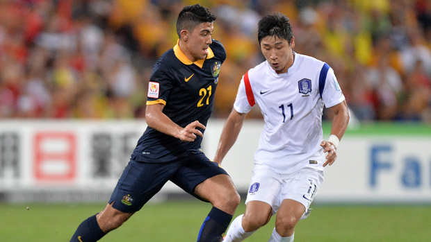 Massimo Luongo takes on the South Korean defence in Brisbane.