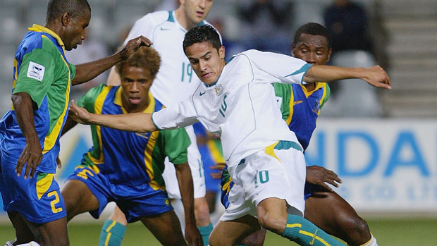 A young Tim Cahill fights for the ball against the Solomon Islands at Hindmarsh Stadium in 2004.