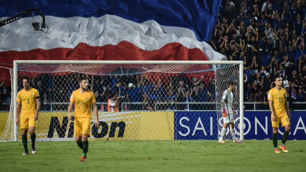 The Caltex Socceroos react following full time at the Rajamangala National Stadium in Bangkok.