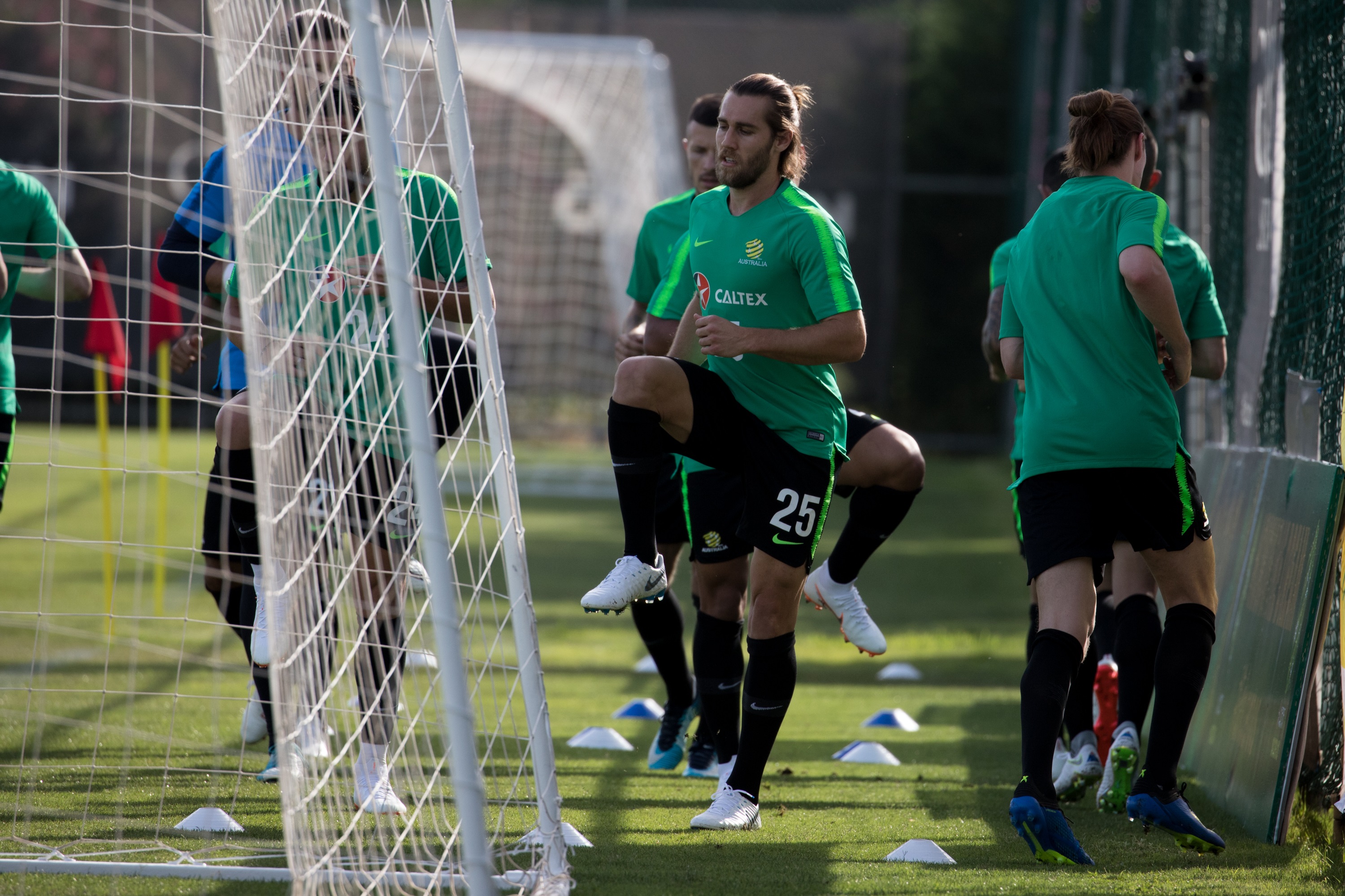 Socceroos players warm up Socceroos players warm up