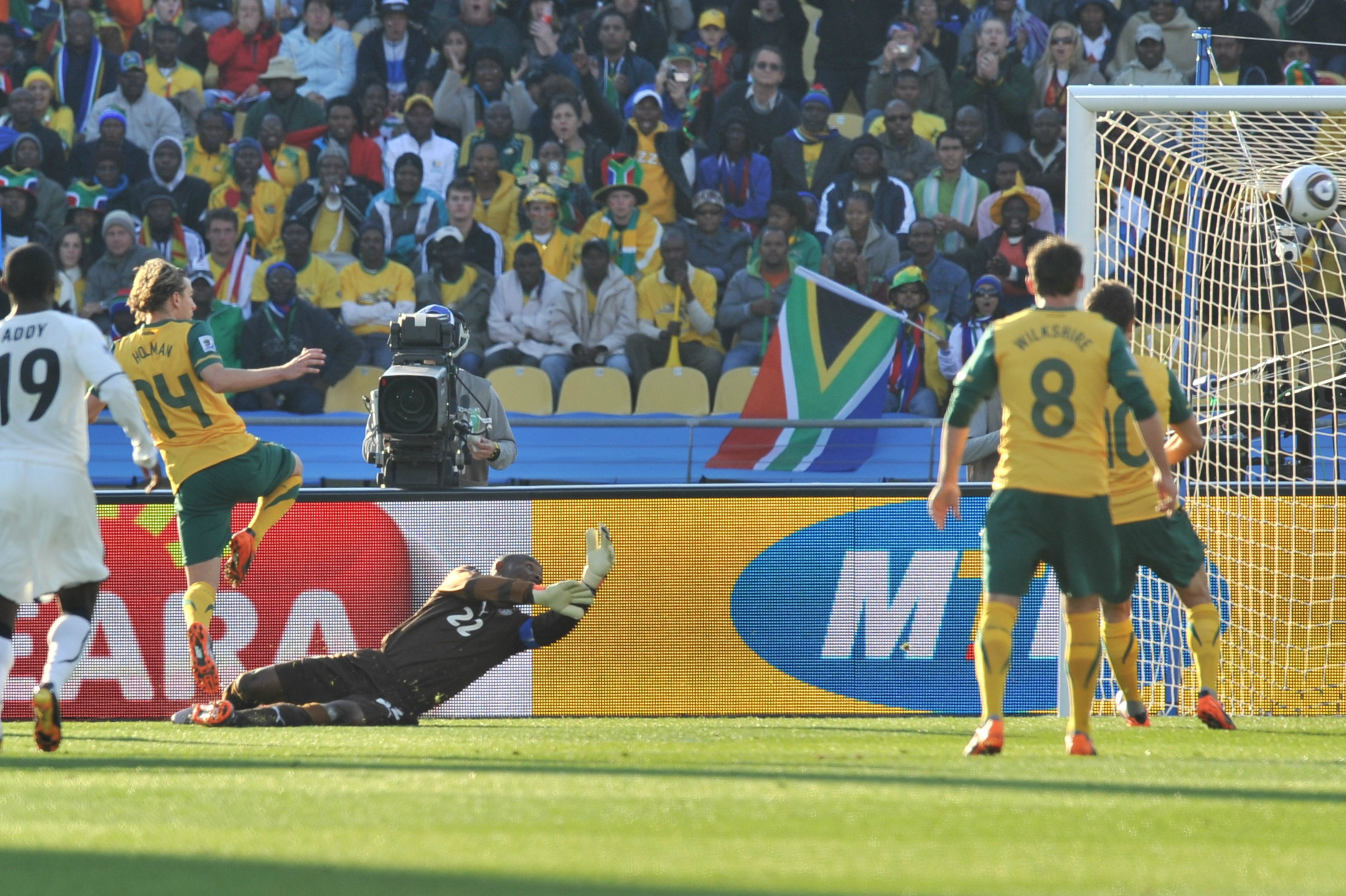 Brett Holman fires into the net against Ghana. Brett Holman fires into the net against Ghana.