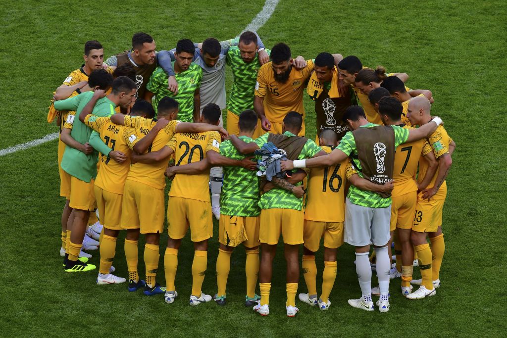 Socceroos players huddle after the France game Socceroos players huddle after the France game