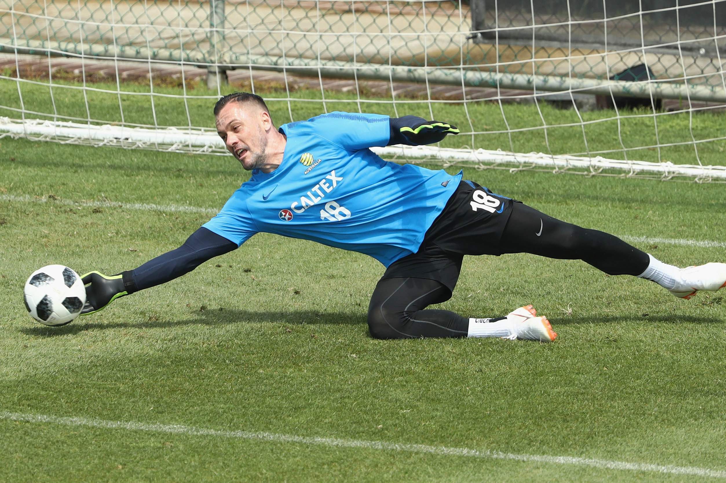 Danny Vukovic gets down low to make a save. Danny Vukovic gets down low to make a save.