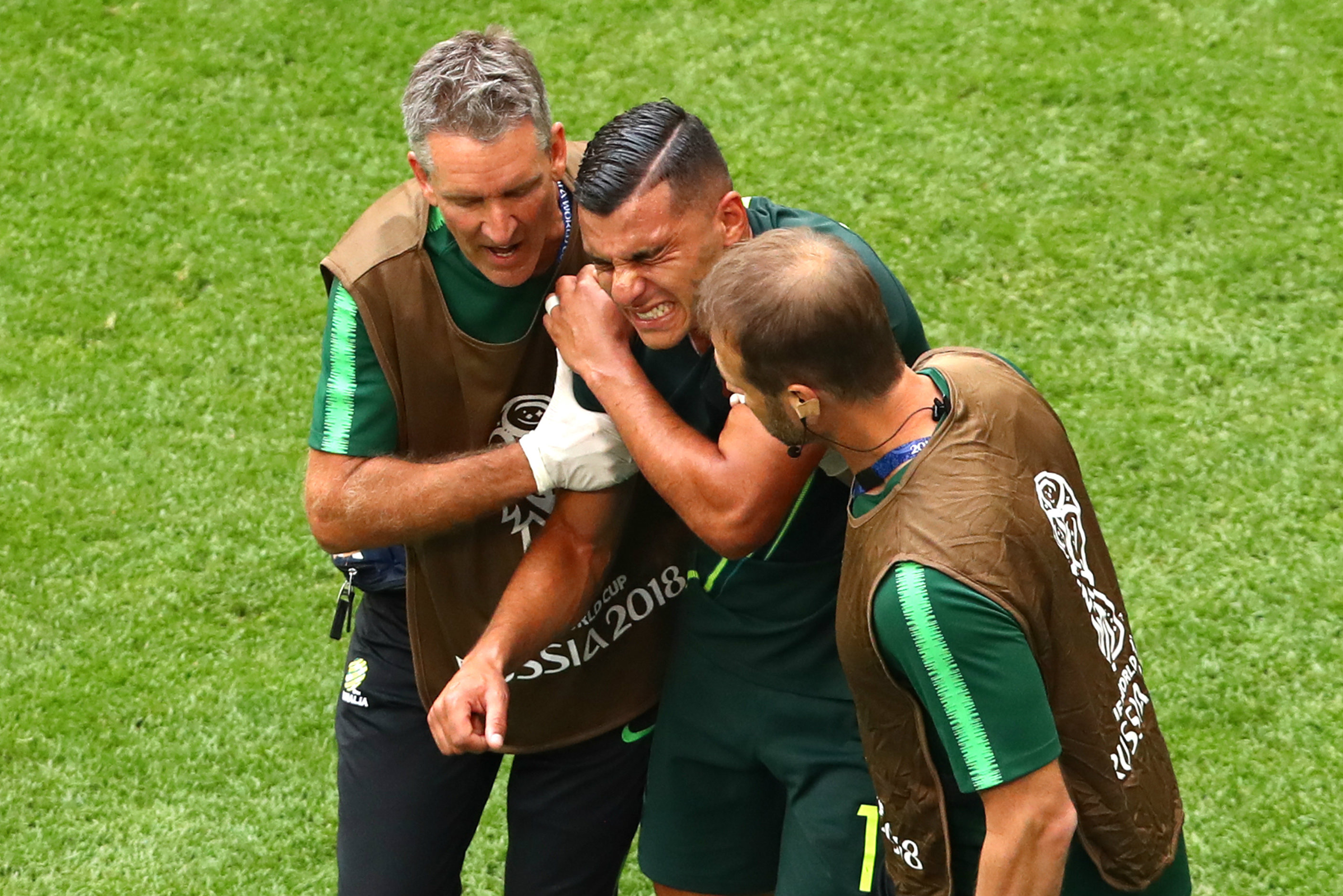 Andrew Nabbout forced off the field in pain against Denmark. Andrew Nabbout forced off the field in pain against Denmark.