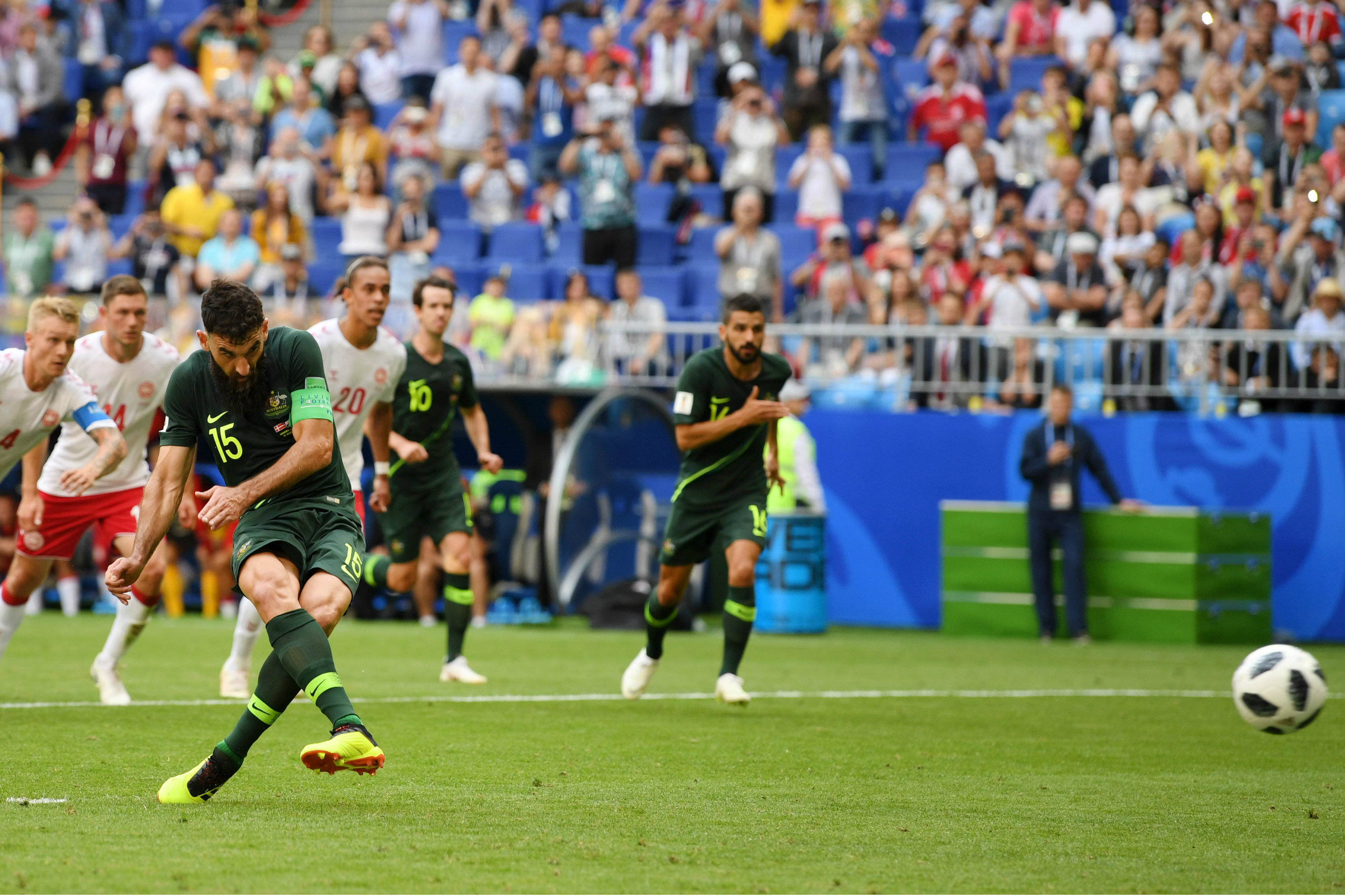 Mile Jedinak dispatches his penalty past Kasper Schmeichel. Mile Jedinak dispatches his penalty past Kasper Schmeichel.