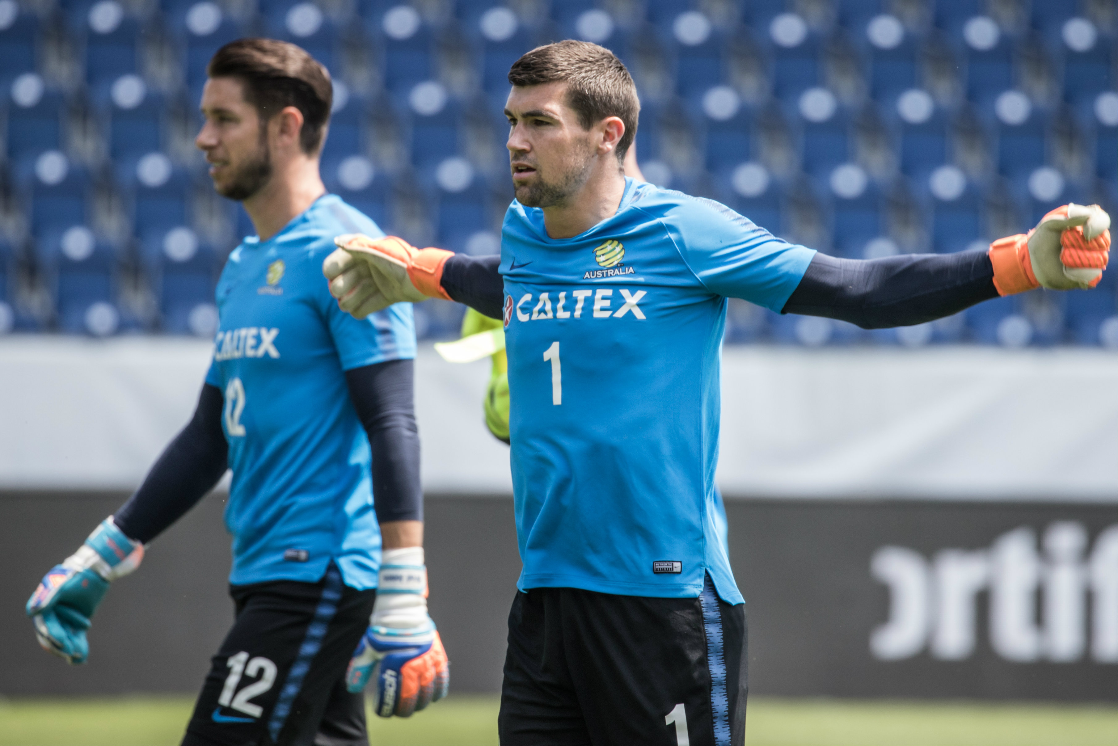 Goalkeeper Mat Ryan limbers up for the session. Goalkeeper Mat Ryan limbers up for the session.