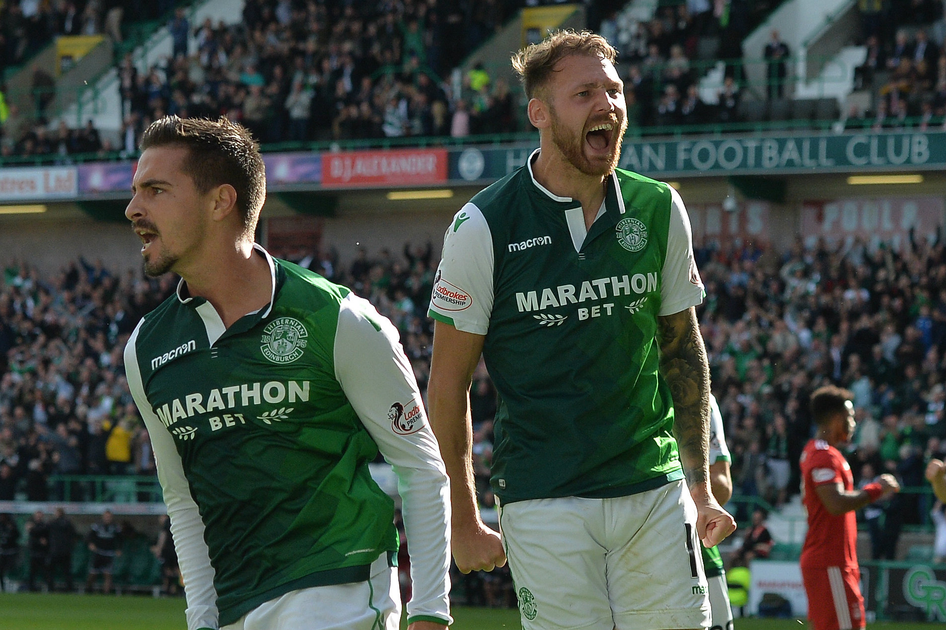 Martin Boyle celebrates a goal with Hibs teammate Jamie Maclaren. Martin Boyle celebrates a goal with Hibs teammate Jamie Maclaren.