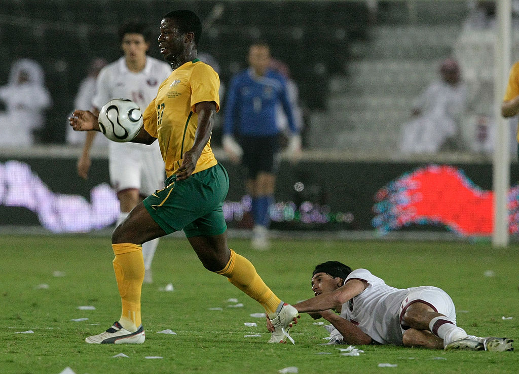 Bruce Djite gets on the ball for Australia during a FIFA World Cup Qualifier in 2008 Bruce Djite in action for Socceroos vs Qatar in World Cup qualifier in 2008