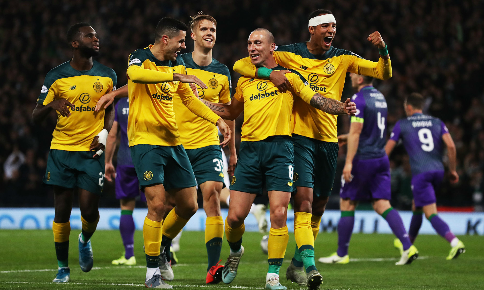 Tom Rogic celebrates with Celtic goalscorer Scott Brown Tom Rogic celebrates with Celtic goalscorer Scott Brown