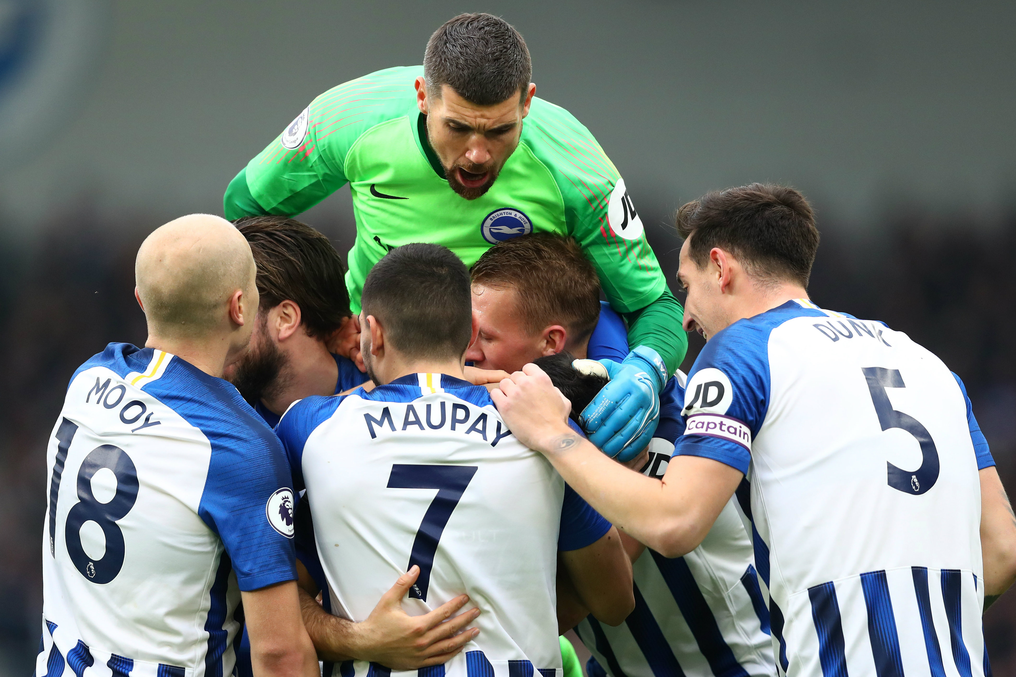 Maty Ryan and Aaron Mooy celebrate Brighton's first goal with teammates Maty Ryan and Aaron Mooy celebrate Brighton's first goal with teammates