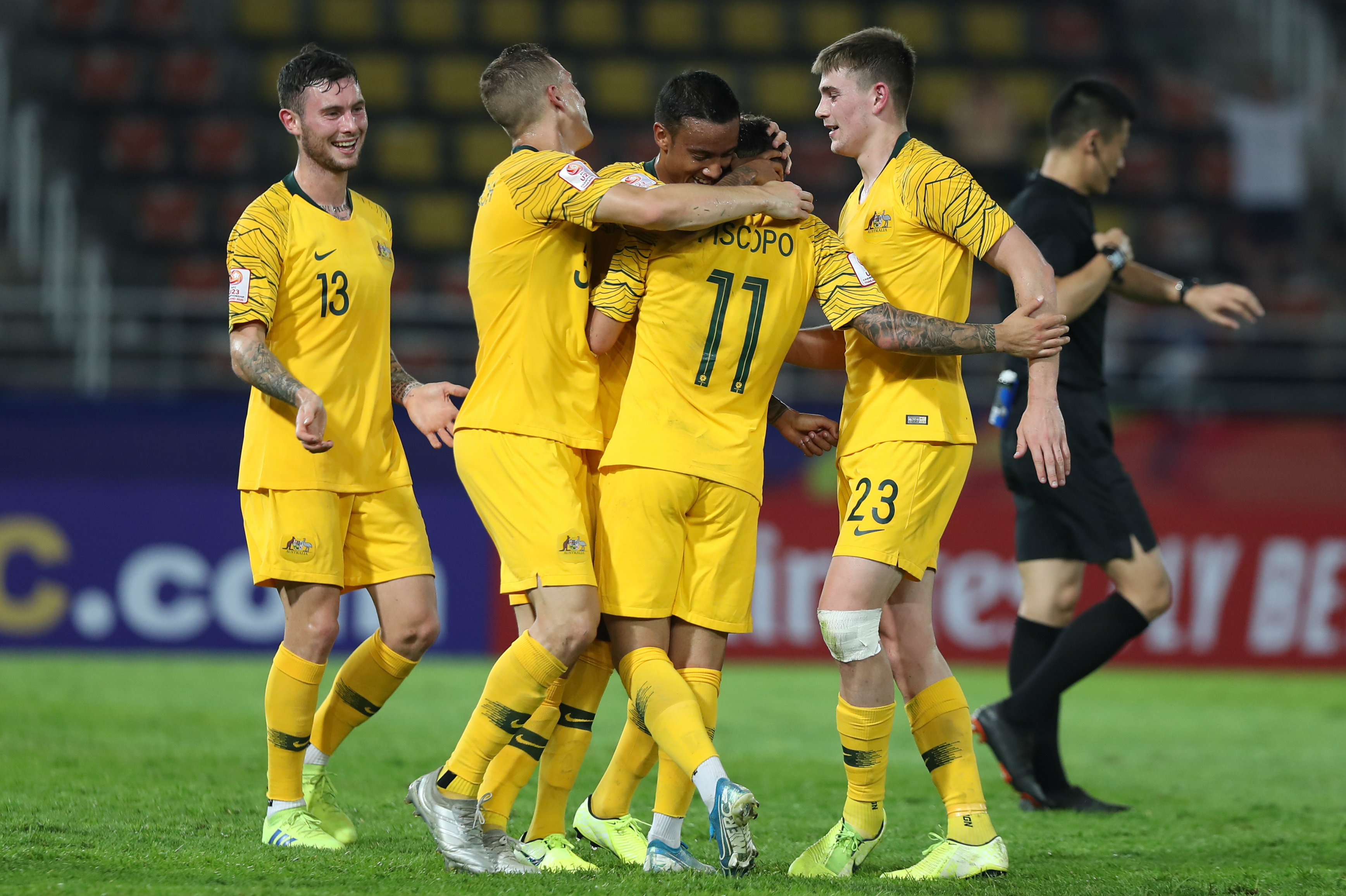 Australian players celebrate Piscopo's stunning goal Australian players celebrate Piscopo's stunning goal