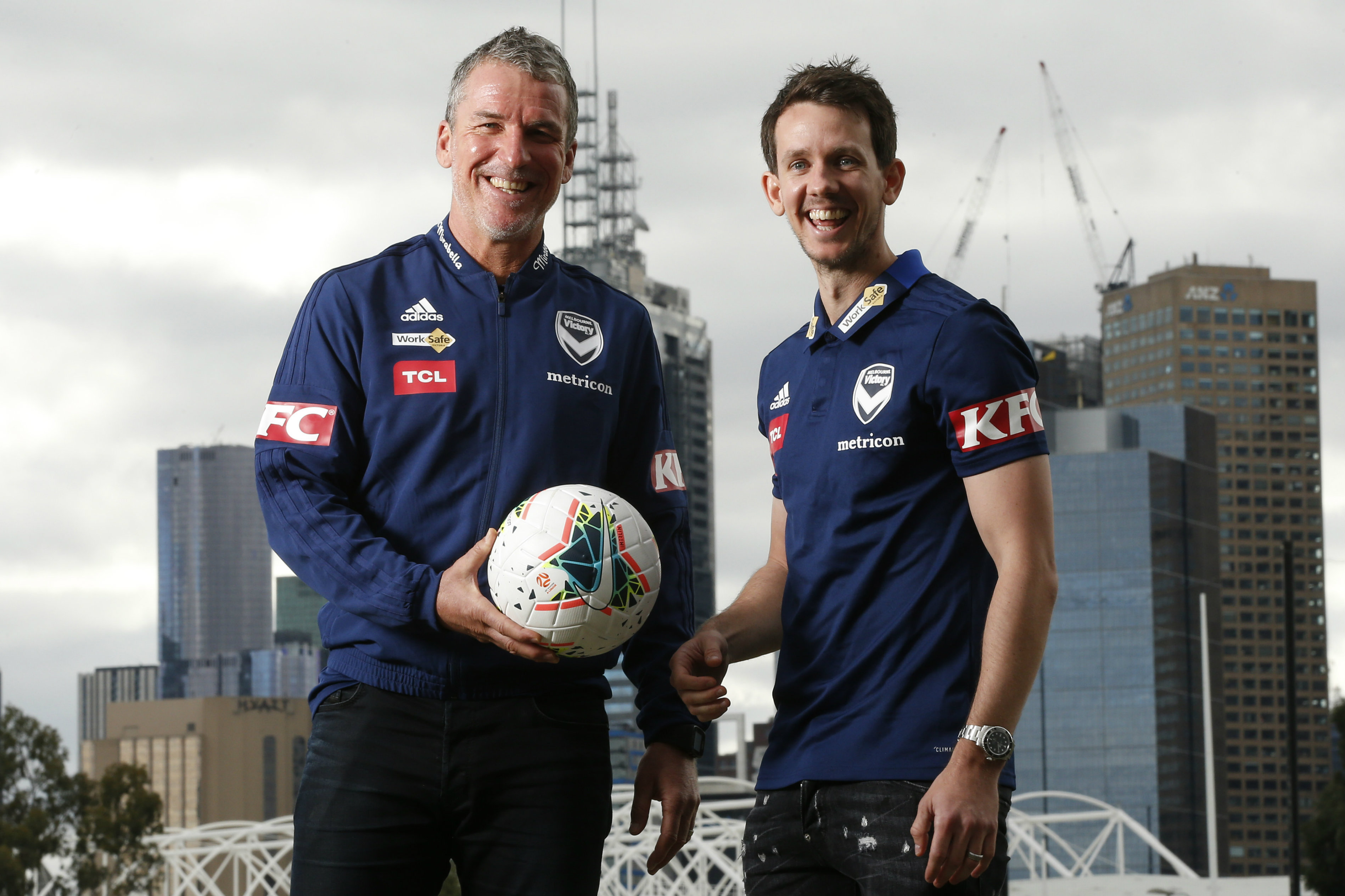 Victory boss Marco Kurz with new signing Robbie Kruse Victory boss Marco Kurz with new signing Robbie Kruse
