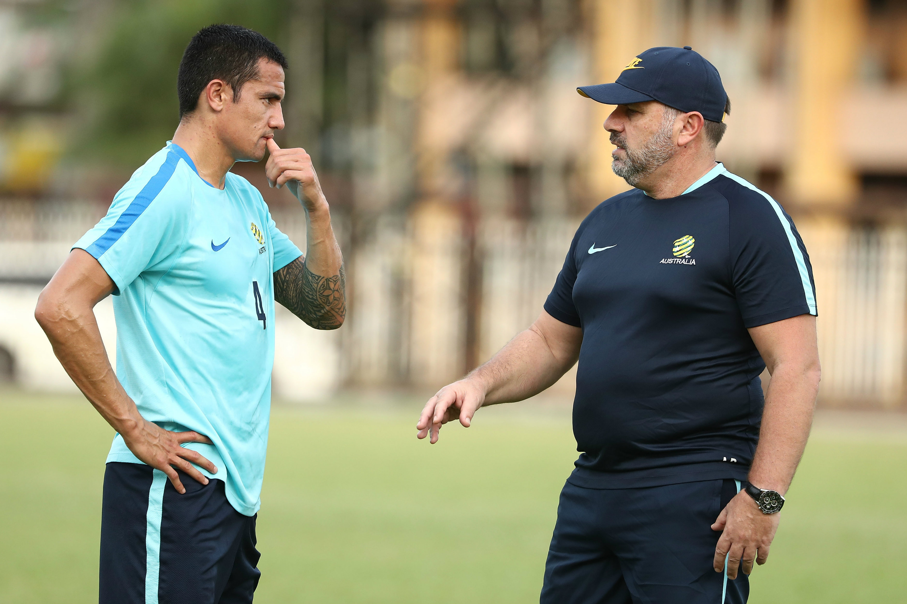 Tim Cahill chats with Socceroos boss Ange Postecoglou.