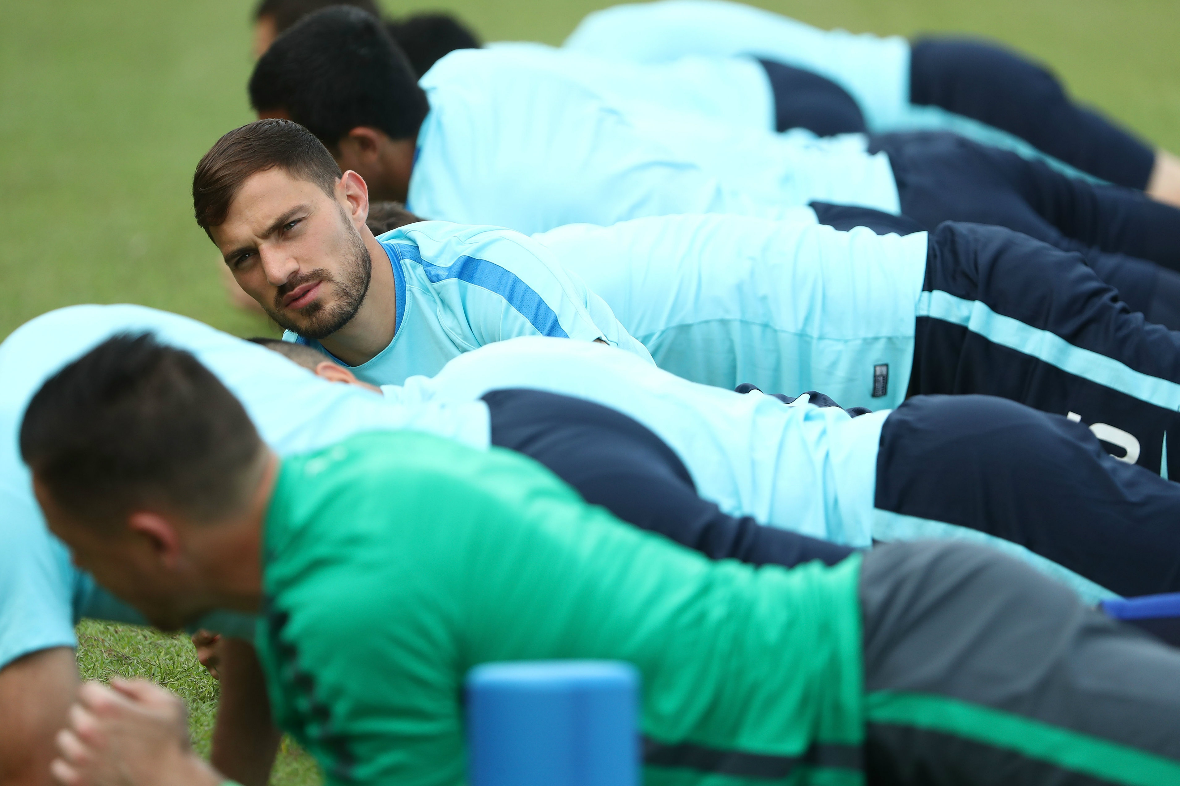 James Troisi stretches at training before the first leg in Malaysia.