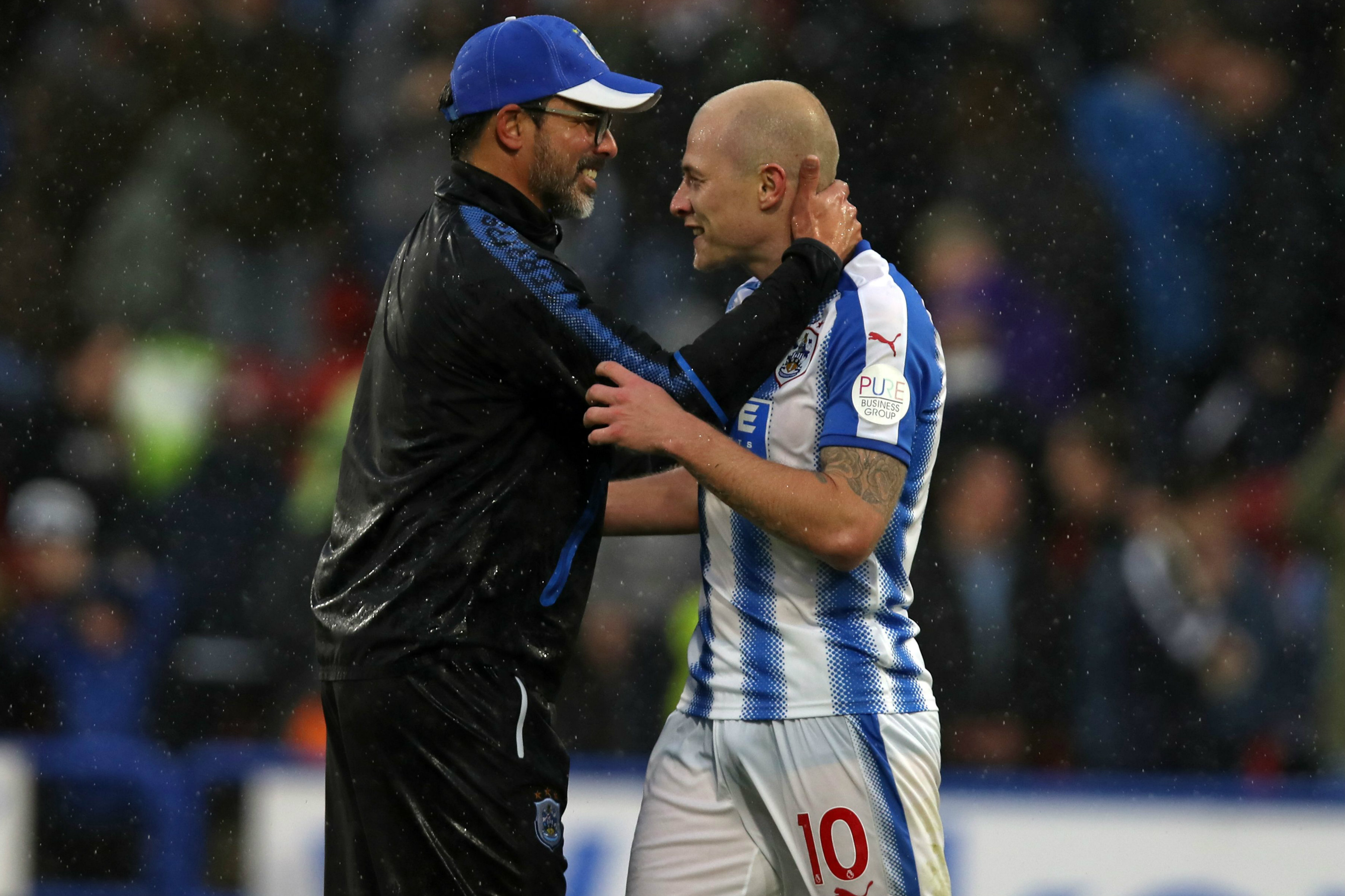 Huddersfield boss David Wagner congratulates Aaron Mooy at full-time.