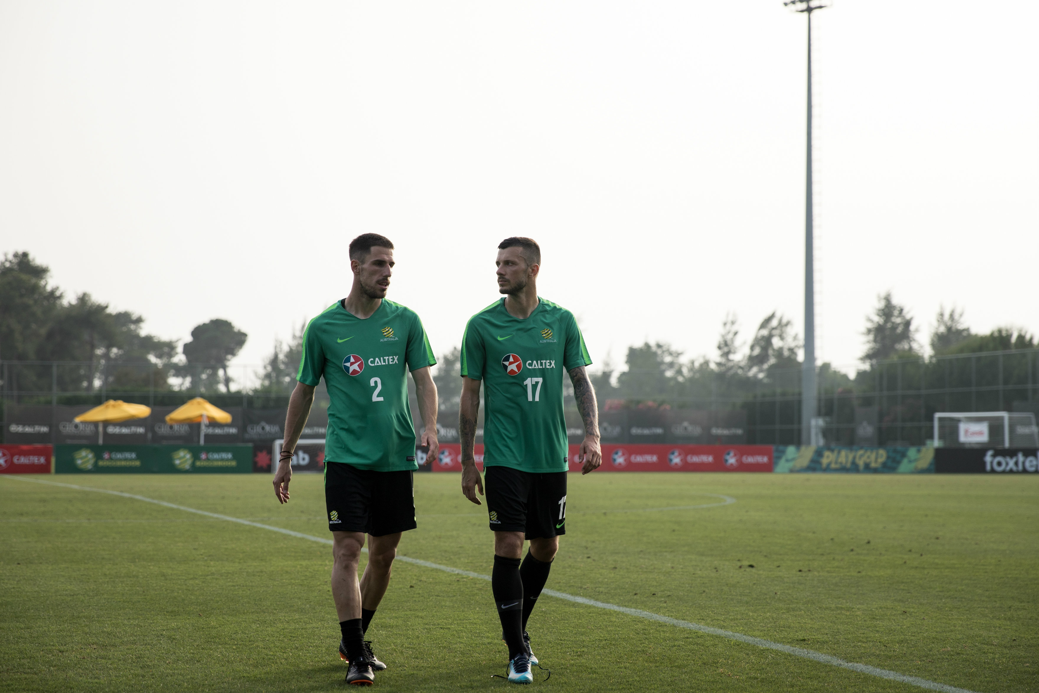 Milos Degenek and Nikita Rukavytsya leave the pitch. 