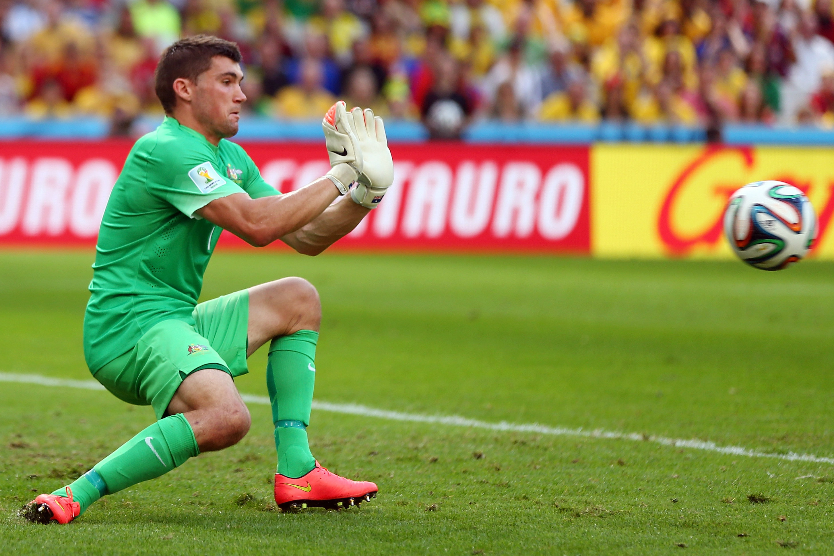 Mat Ryan makes a save against Spain at the 2014 World Cup.