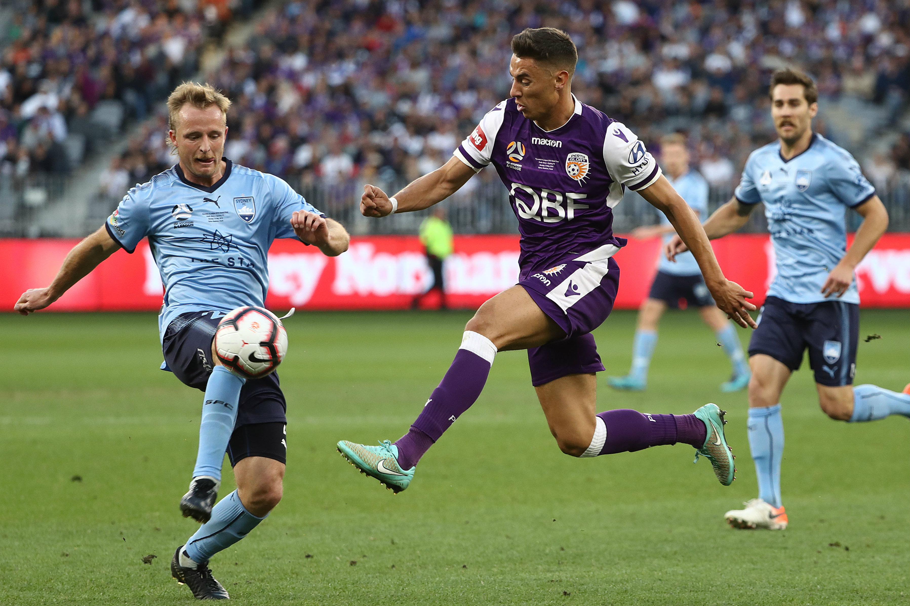 Rhyan Grant and Chris Ikonomidis fight for the ball during Sunday's Hyundai A-League Grand Final